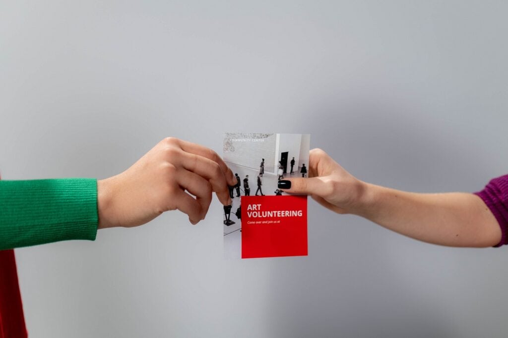 People holding a flyer
