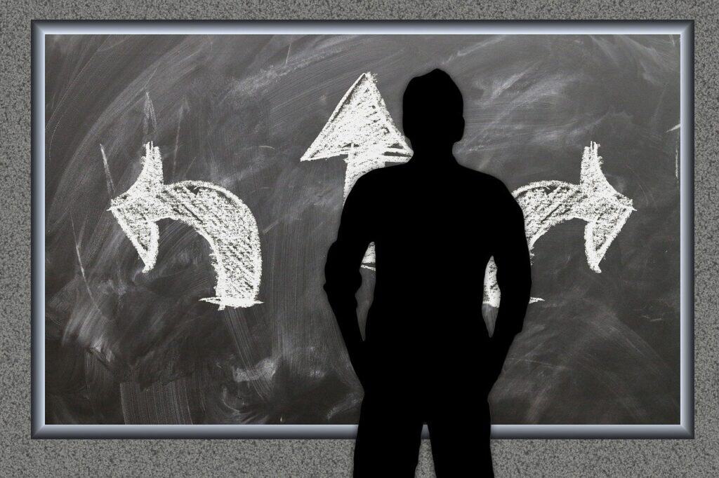 Man in front of blackboard